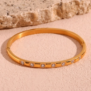 Detail of 18K gold-plated stainless steel bangle with micro-pave cubic zirconia