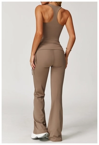 Rear view of women's taupe yoga set featuring racerback top and flared fitness pants