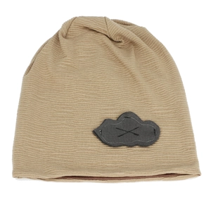 Detail of khaki ribbed knit beanie featuring a grey cloud patch with cross stitching