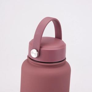Close-up of matte burgundy water bottle lid and carry strap with silver metal rivet
