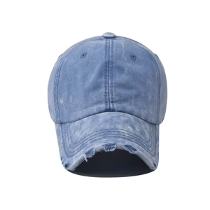 Vintage blue washed denim baseball cap with distressed brim and retro style details