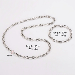 Silver stainless steel 7mm curb chain necklace and bracelet set for men on white background