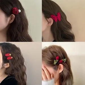 Detailed views of four red floral and bow hairpins worn by a model in a grid display