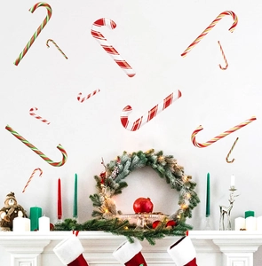 Detail showing candy cane wall stickers in red and white on a festive living room wall