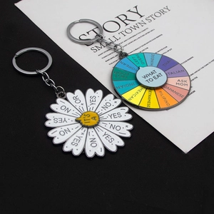 Detail view of colorful decision maker keychain for food choices and daisy yes-no spinner