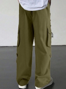 Detail view of military green cargo pants featuring multiple pockets and a loose straight fit
