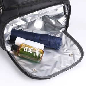 Detail of insulated silver foil lining inside black sports backpack for wet gear storage