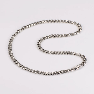 Macro detail of 6mm stainless steel Cuban link necklace with polished silver finish