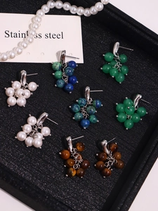 Detailed cluster of handmade natural stone and shell pearl earrings in four colors