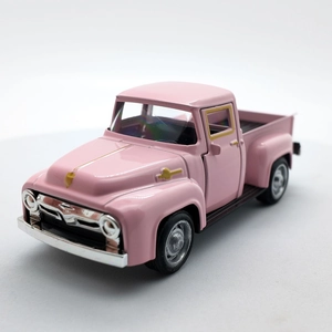 Close-up of pink vintage alloy pickup truck toy with realistic retro design details