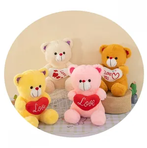 Close-up of colorful plush teddy bears with heart-shaped pillows in a cozy setting