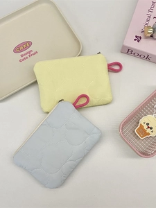Quilted heart-shaped coin purses in yellow and blue with cloud texture and pink zippers
