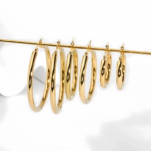 Set of six gold hollow hoop earrings in graduated sizes with a polished finish