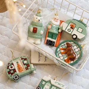 Set of creative Christmas ornaments featuring Santa, bears and RV on festive backdrop