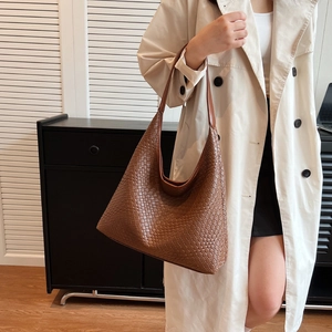 Brown woven faux leather tote bag with large capacity and integrated shoulder strap
