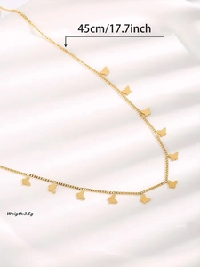 Detail showing gold butterfly necklace on silk background with 45cm length and weight info