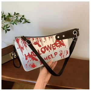 Detail of Halloween cleaver bag with red blood splatters and HELP text on silver PU leather