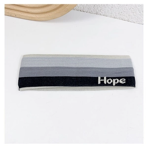 Detail of grey gradient sports headband with Hope embroidery on white background