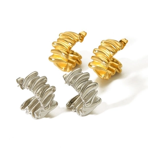 Orecchini vintage in acciaio al titanio con design a onde in oro e argento su bianco