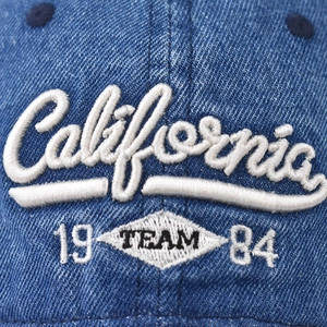 Blue washed denim baseball cap with white 3D California embroidery detail