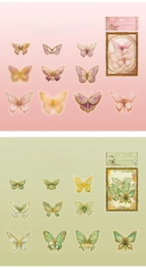 Close-up of holographic laser butterfly stickers with gold foil details for scrapbooking