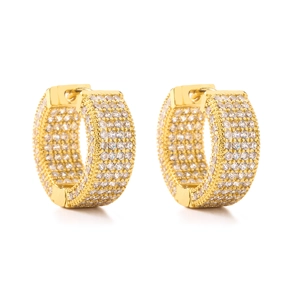 Macro detail of wide gold-plated huggie earrings with four rows of CZ pavé diamonds