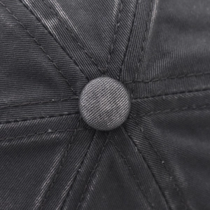 Macro shot of charcoal grey washed cotton twill cap top with reinforced seam details