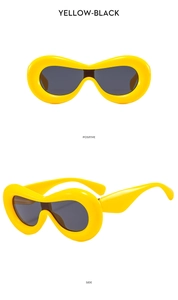 Front and side views of chunky yellow Y2K sunglasses with dark oval lenses