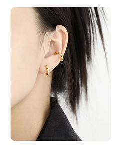 Detailed view of minimalist gold plated S925 sterling silver ear cuff and hoop earrings
