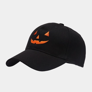Detail of Jack-o'-lantern pumpkin embroidery on black cotton baseball cap for Halloween