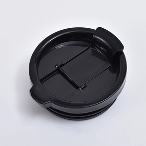 Detail of black plastic lid with flip-top design and leak-proof seal for speaker tumbler