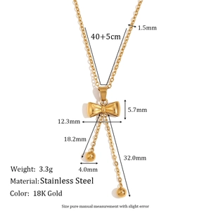Minimalist 18K gold-plated stainless steel bow necklace with bead tassels on white background