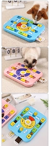 Detail of interactive pet puzzle feeder with sliding bone blocks and snack drawers