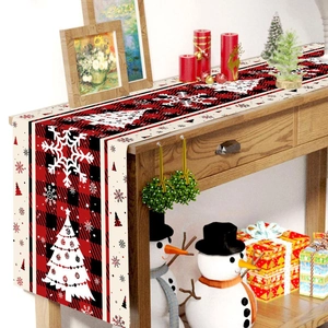 Christmas table runner with red and black buffalo plaid patterns and snowflake design