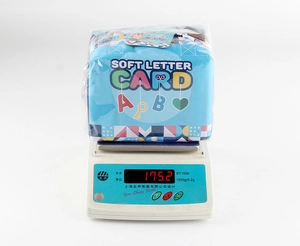 Detailed weight measurement of 175.2g for infant soft alphabet card set in packaging