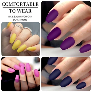 Detail showing matte false nails in yellow, purple, rose pink and dark blue colors