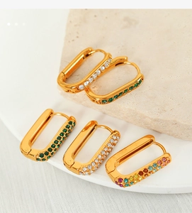Detail of rectangular titanium steel hoop earrings featuring colorful zircon stones