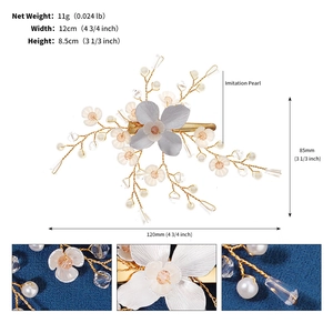 Detailed view of handmade floral hair clip with imitation pearls and crystals on gold wire