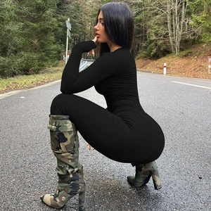 Close-up of black ribbed long-sleeve bodysuit paired with camouflage high-heel boots