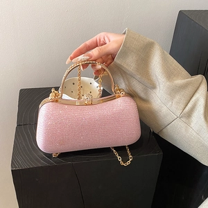 Elegant pink sequin evening handbag with a gold crystal handle and chain strap