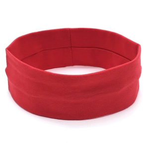 Detail of red elastic sports headband showing the soft knit texture and durable stitching