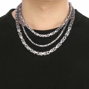 Triple layered silver stainless steel Byzantine chain necklace for men shown on model