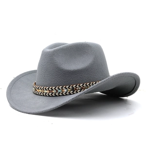 Classic grey wool western cowboy hat with a bohemian woven decorative band on white background