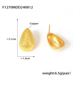 Detail showing dimensions and fish scale texture of golden teardrop copper earrings