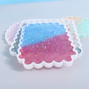 Glitter resin wavy square coasters in blue-pink gradient and silver with sequin inlay