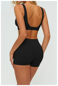 Detailed back view of hollow geometric open back yoga sports bra and high waist shorts