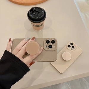 Detail of khaki and beige soft TPU phone cases with integrated pop-up sockets