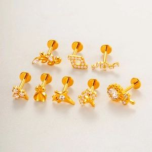 Set of 8 gold titanium flower stud earrings featuring star crown and butterfly designs
