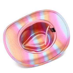 Detail view of colorful holographic cowboy hat interior with pink sweatband and fabric label