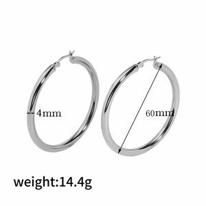 Detail shot of 60mm silver hoop earrings showing 4mm thickness and 14.4g weight